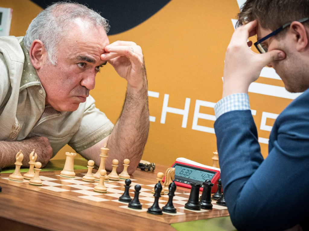 Garry Kasparov playing a game of chess with his opponent